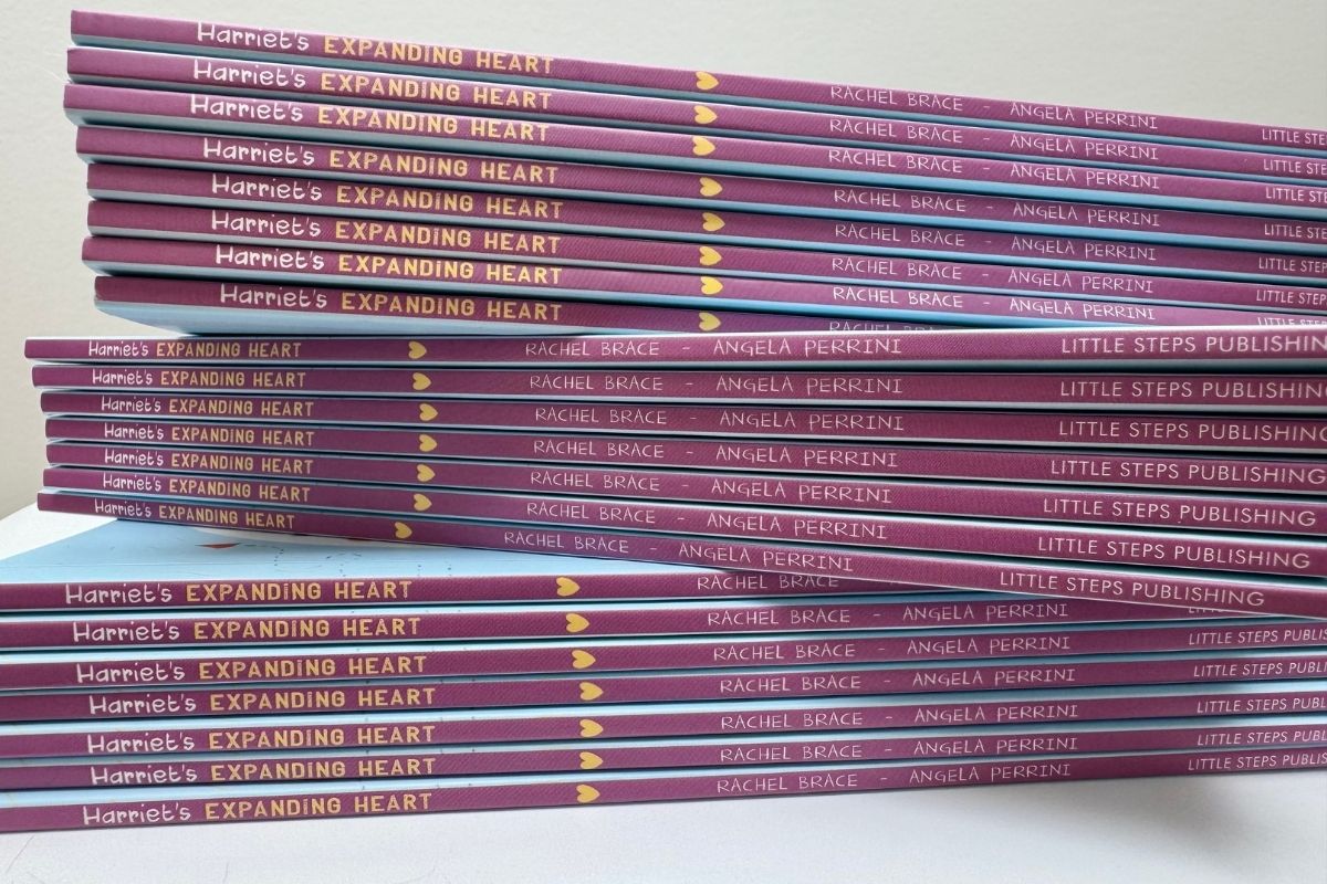 Stack of books titled 'Harriet's Expanding Heart' by Rachel Brace