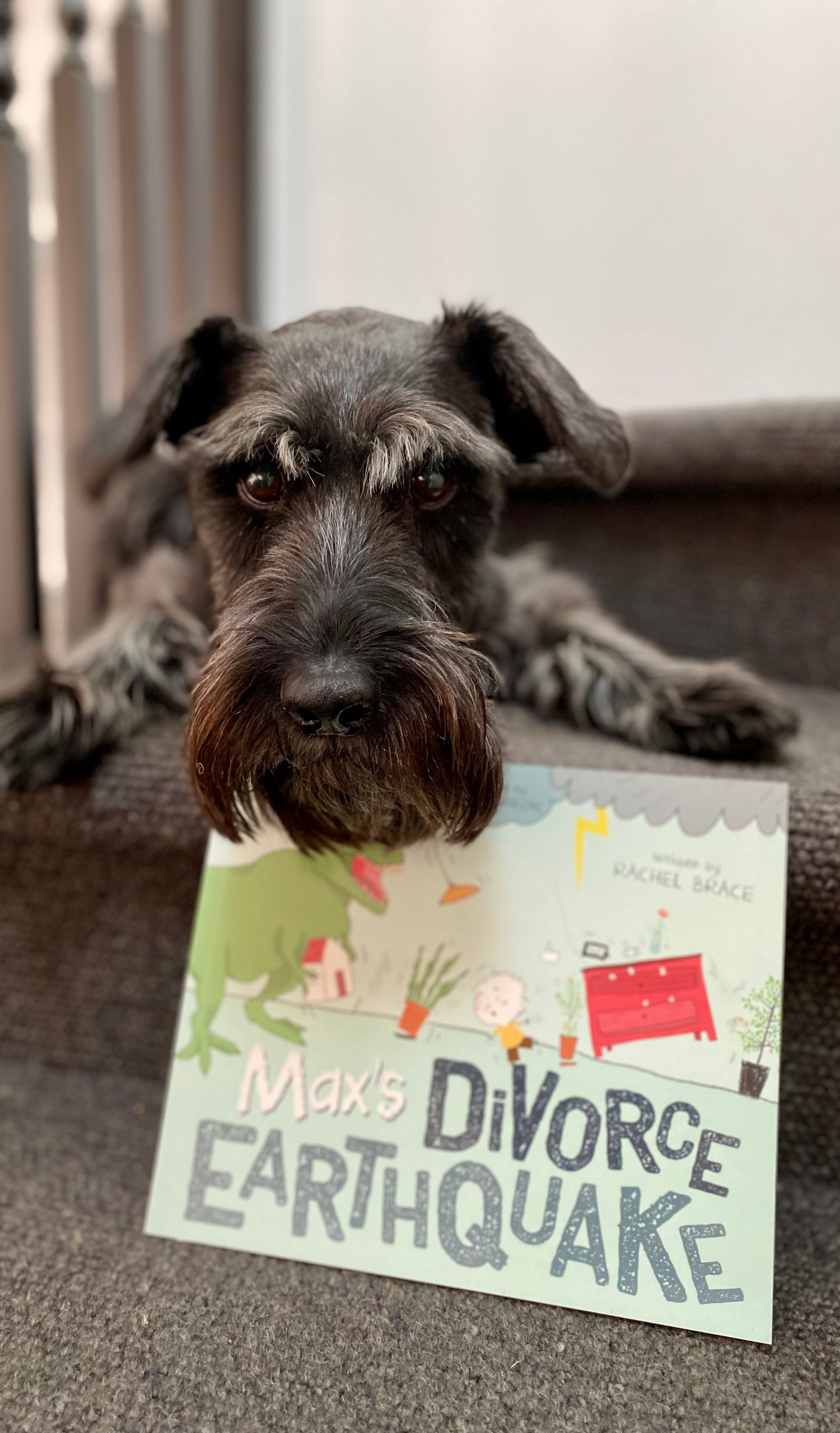 Maxie with front cover of Max's Divorce Earthquake